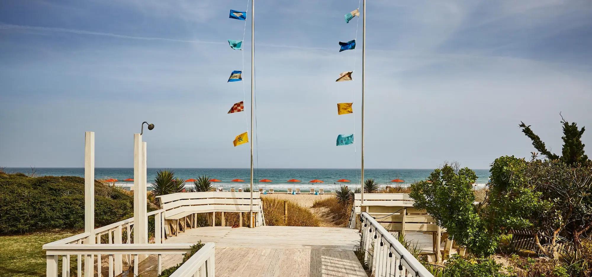 Beach pathway with colorful flags